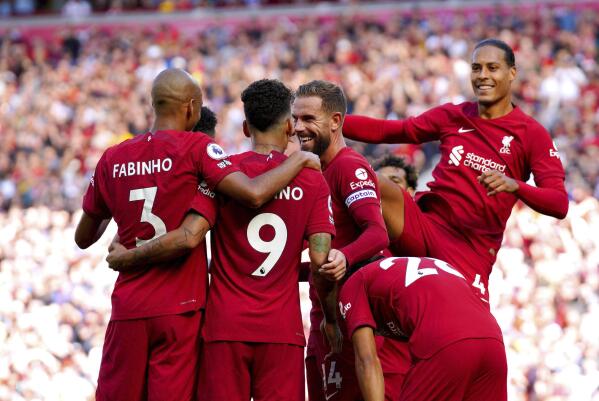 Rampant Liverpool scores 9 Haaland nets hat trick for City AP News